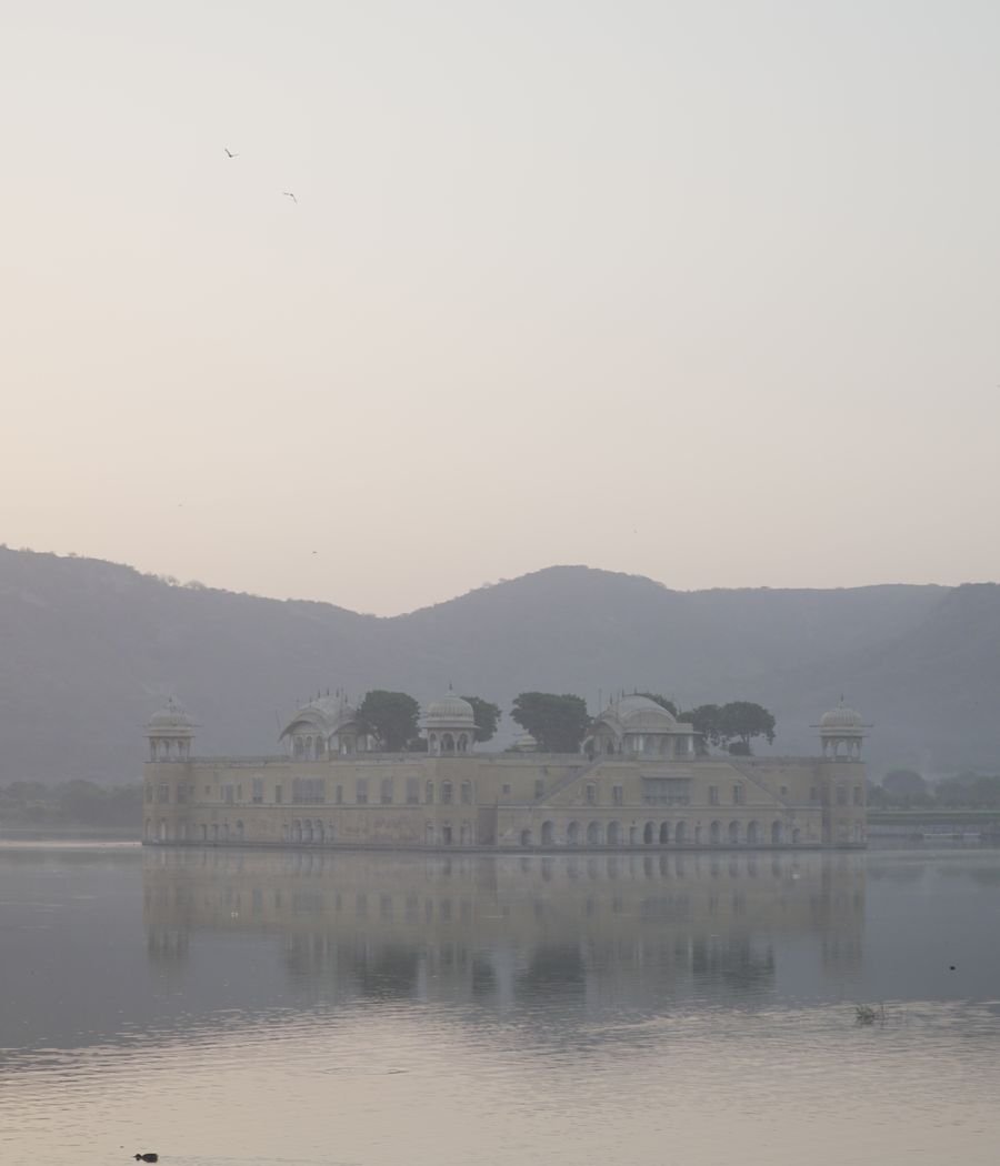 A palace on the water at first light in India