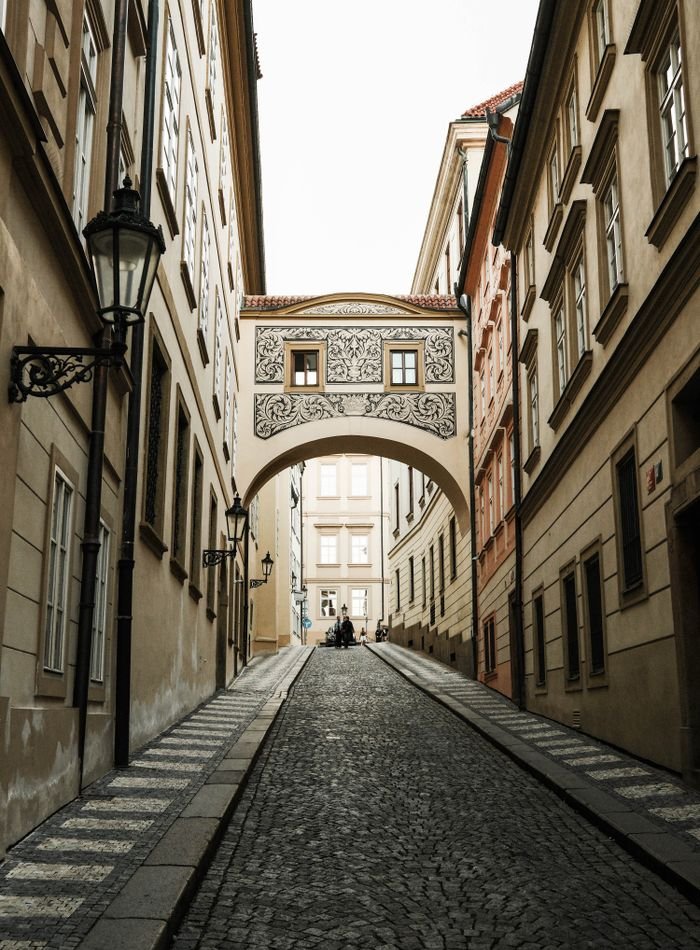 Cobbled old town lane between historic European buildings